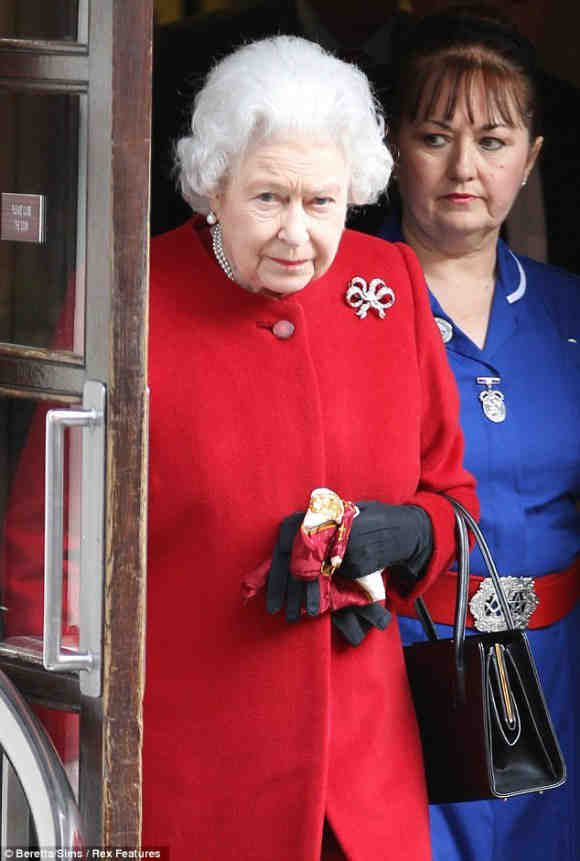 The Queen's nurse is wearing a belt buckle bearing Masonic symbols