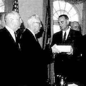 Brother Johnson receiving the Warren Commission Report on the Kennedy Assassination from Brother Warren