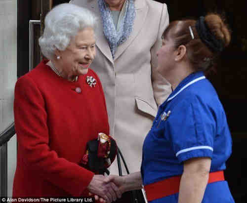 The Queen's nurse is wearing a belt buckle bearing Masonic symbols
